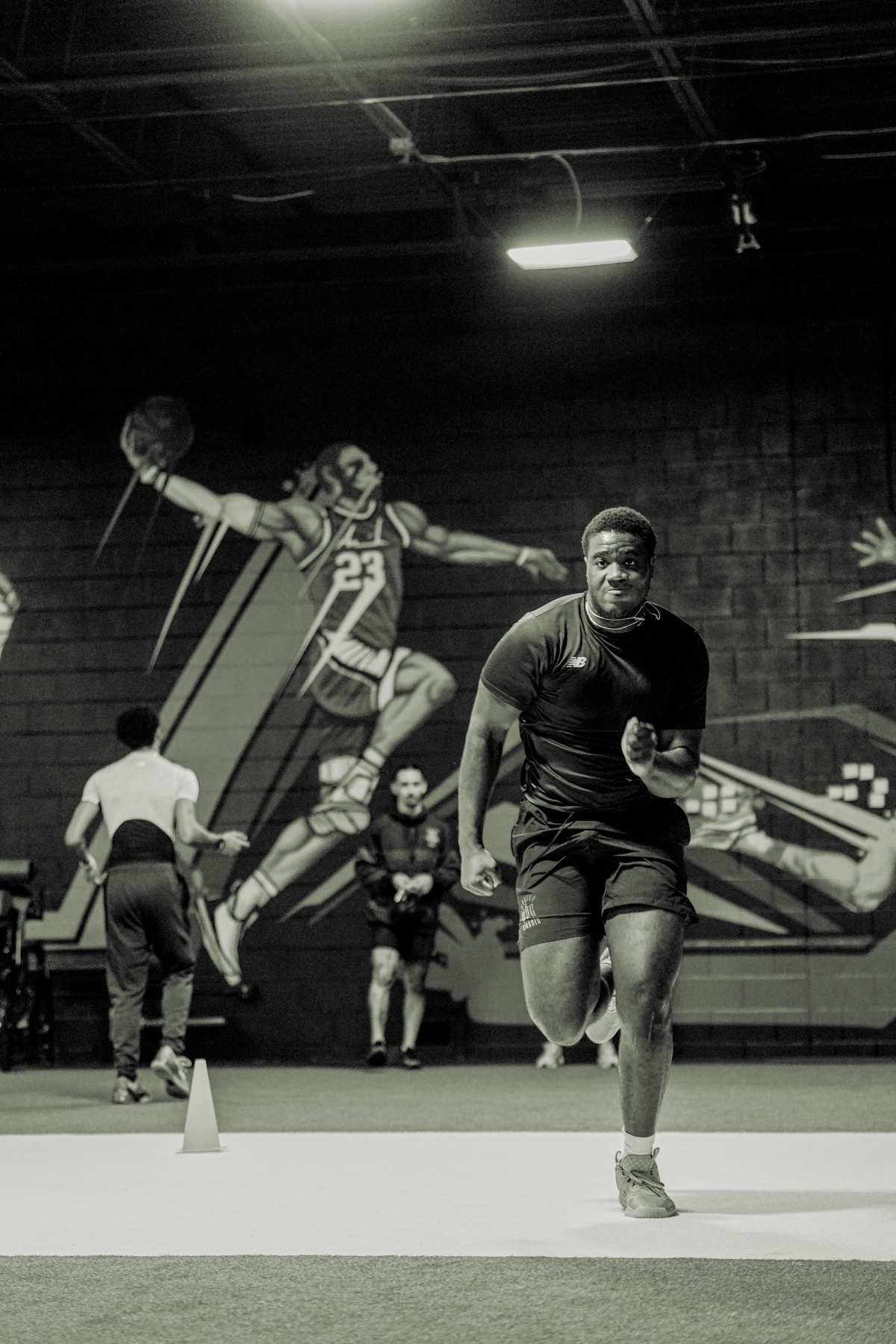 Athlete in full stride during indoor training